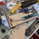 Battery is now located in a box epoxied onto the board. The pvc end pieces are where black powder charges are ignited to blow off the fin can and nosecone (top and bottom) in sequence.